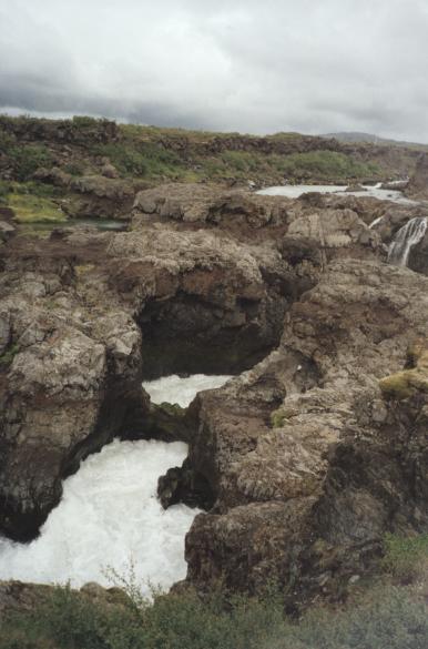 Barnafoss ravine and the lava fields above Hraunfossar