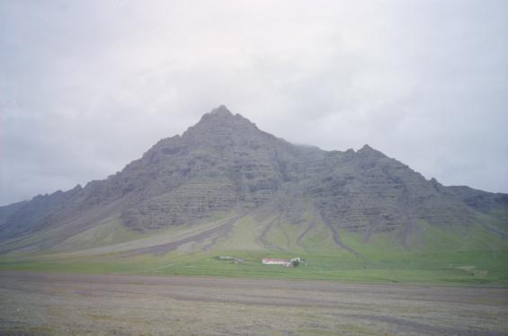 A farm under the mountains