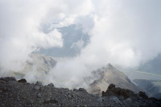 The view from the glacier into the valley under cloud below