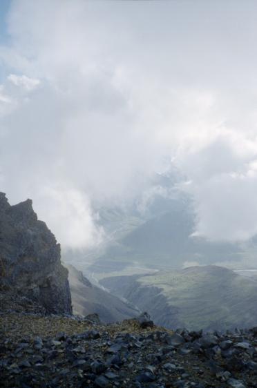 The view from the glacier into the valley under cloud below